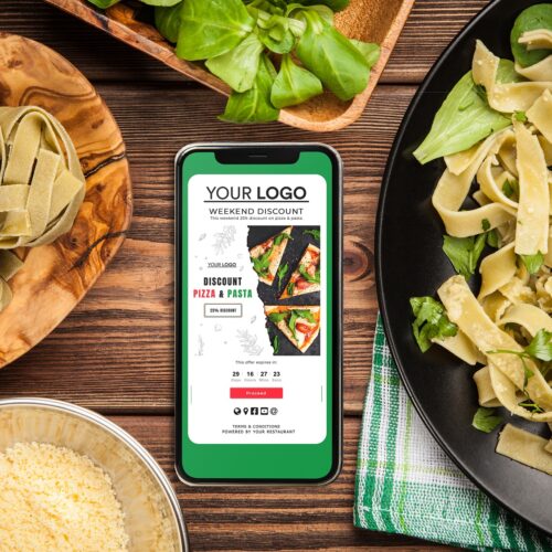 Cooked tagliatelle on a plate Cooked tagliatelle pasta ingredients and a smartphone
